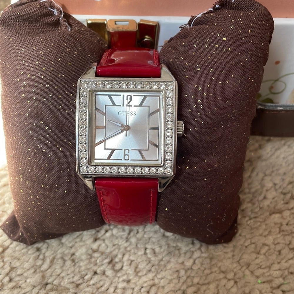 Beautiful guess square face watch with interchangeable bands.